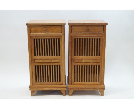 A pair of modern teak cupboards, each with a single shelf and drawer, 100cm high x 48cm wide x 45cm deep