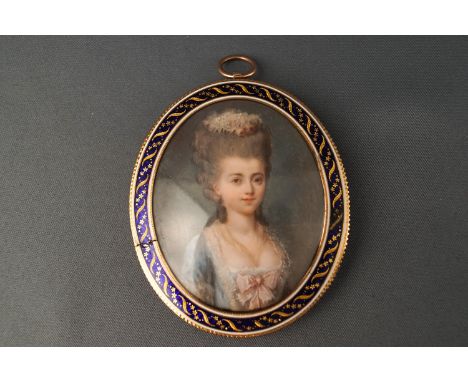 An 18th century portrait of a lady in a blue dress, watercolour on ivory, in a yellow and enamel frame with hair back, inscri