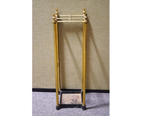 A brass stick stand of square form with four sections, 64cm high