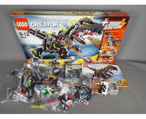 LEGO - # 4958 Creator Monster DIno set, the box has been opened and there are parts loose inside and parts in zip lock bags s