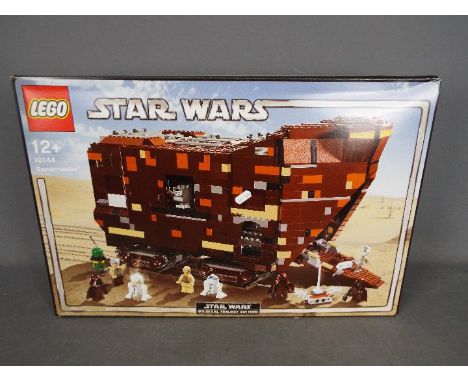 LEGO - # 10144 Star Wars Sandcrawler, the box has been opened and the parts are in zip lock bags so it is unchecked for compl