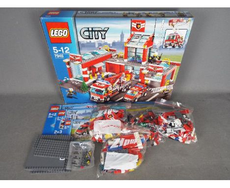 LEGO - # 7945 City Fire Station set in an open box with the parts in zip lock bags so it is unchecked for completeness. The b