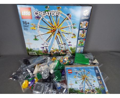LEGO - # 10247 Ferris Wheel set in an opened box with parts in zip lock bags so it is unchecked for completeness. The box is 