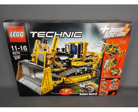 LEGO - # 8275 Technic motorized Bulldozer set, the box has been opened and the parts are all in zip lock bags so it is unchec