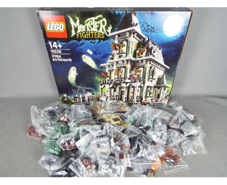 LEGO - # 10228 Monster Fighters Haunted House set in an open box with parts in zip lock bags so it is unchecked for completen