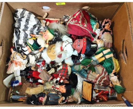 A selection of dolls in world clothing and other vintage dolls etc 