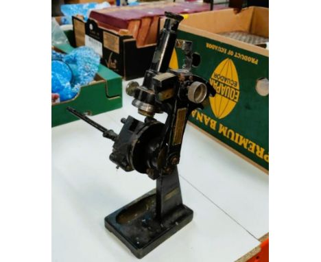 A vintage microscope with integral side measure by Adam Hilgar 