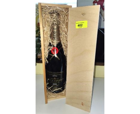 A wooden cased bottle of Millesime Blanc Moet &amp; Chandon Champagne 1999 vintage 