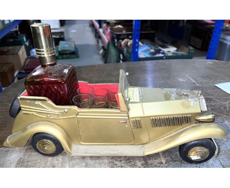 A vintage Rolls Royce musical decanter mixed liqueur set, and five glasses 