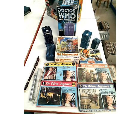 A selection of vintage Doctor Who jigsaws; a Comet plastic construction kit MK1 Dalek; a Tardis cookie jar; vintage Sonic scr
