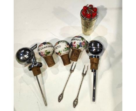 A selection of 1920's and later alcohol related items: ceramic bottle stops; measures; etc. 