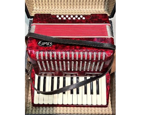 A red 12 bass Accordion by Bell with case 