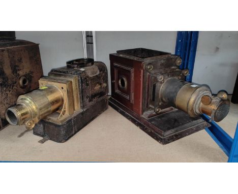 A brass and japanned metal magic lantern; a mahogany magic lantern (incomplete)&nbsp; 