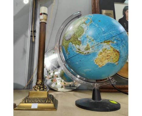 A globe, height 38cm; a gilt Corinthian column lamp; a painted convex mirror 