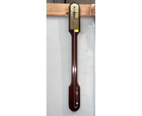 A reproduction Georgian stick barometer in mahogany case, with exposed mercury tube; a reproduction wall clock 