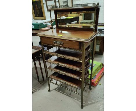 A 19th century brass and wooden aesthetic movement ecclesiastical music stand with brass named shelves, single drawer and mir