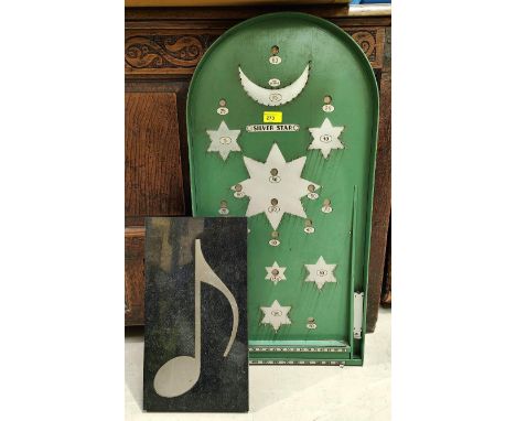 A 'Silver Star' bagatelle board; a wall hanging marble musical note 
