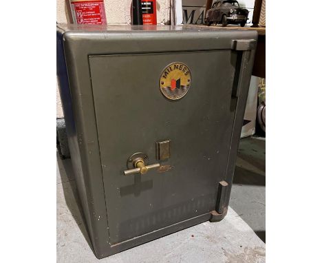 A Milner's safe with keyPLEASE NOTE: This item is extremely heavy and any purchaser will be responsible for supplying the nec