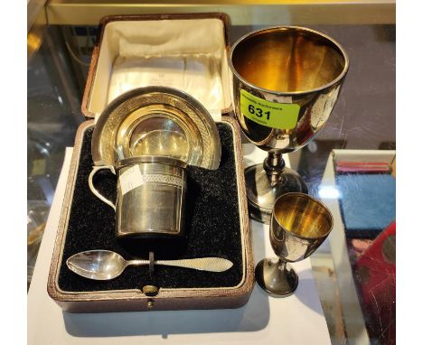 A hallmarked silver christening set, boxed, Birmingham 1929; 2&nbsp;hallmarked silver trophy cups, 7.5oz 