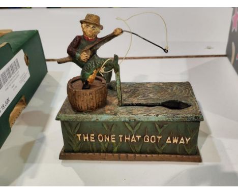An American vintage cast iron money box:&nbsp; The One That Got Away, 17cm 