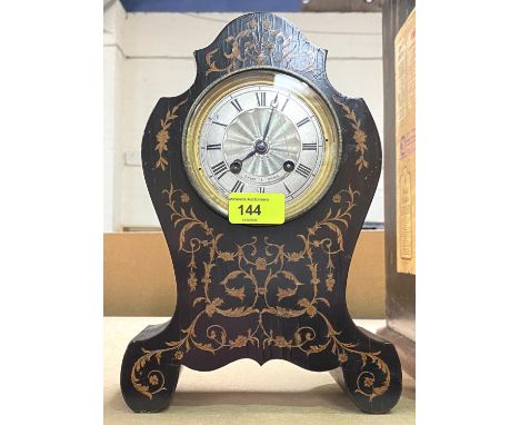 A French mantel clock in rococo style inlaid mahogany case, silvered dial lettered 'Laine Paris' 