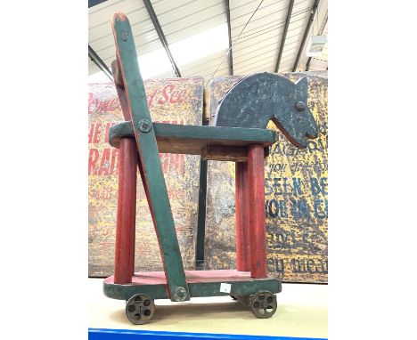 A 19th century metal bound agricultural yoke, 189cm; a vintage ride along toy 