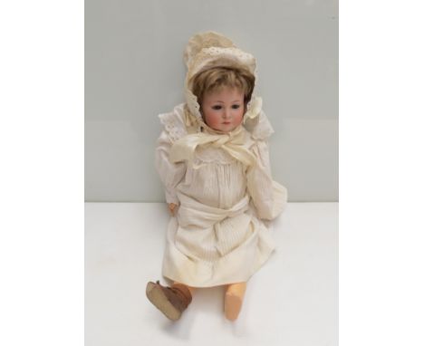 A Simon & Halbig bisque head, composition body girl doll, head stamped K Star R Simon & Halbig 117, 18" tall, finger missing
