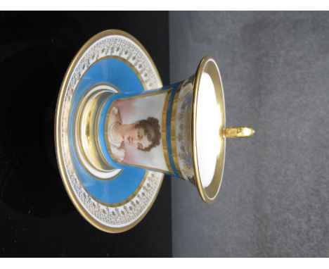 A circa 1900 Sevres portrait and turquoise and gilt cup and saucer, painted with a lady of the French Court