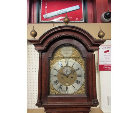 A Georgian oak longcase clock with arched brass dial and silvered Roman chapter ring, signed, Robert Grinling, Yarmouth, seco