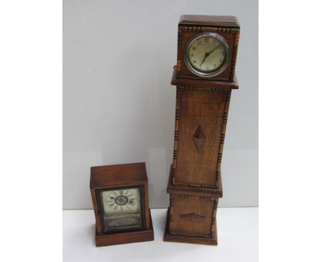 An American mahogany cased alarm clock and an oak cased miniature longcase clock with silvered Arabic dial (2)