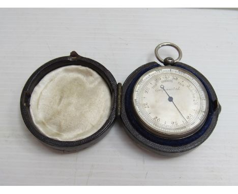 A silver cased small pocket aneroid barometer with silvered dial, in leather case