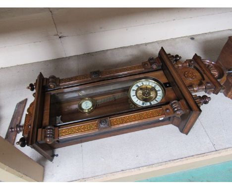 A walnut veneered Vienna style wall clock, Roman enamelled chapter ring, 8 day movement striking on a coiled gong, key and pe