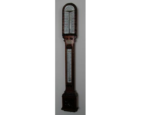 An oak ornately carved medium oak Admiral & Fitzroy style barometer, maker Negretti & Zambra, Opticians to Her Majesty, Londo