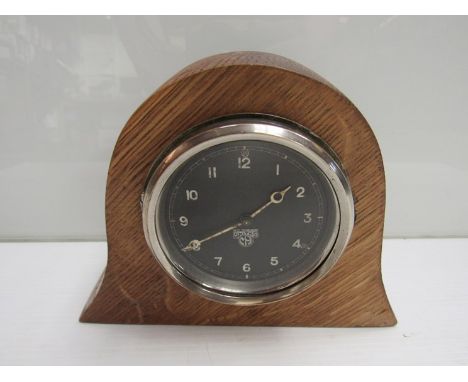 A Smith's dashboard clock with black dial and white painted Arabic numerals, in oak fitted case, 13.4cm high