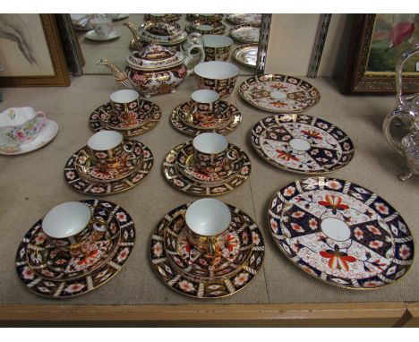 A Royal Crown Derby Old Imari pattern tea set comprising mid 19th Century tea pot (spout restored) six cups, saucers and five