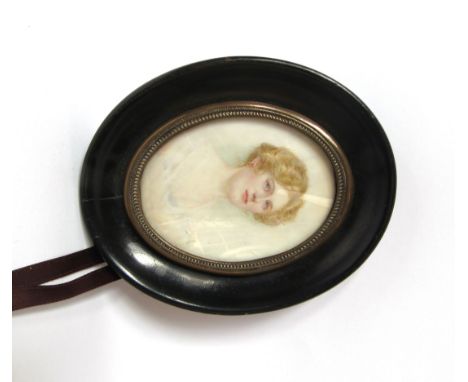 A late 19th early 20th Century hand painted portrait of a lady on ivory, ebonised surround, 7.5 x 5.5cm 