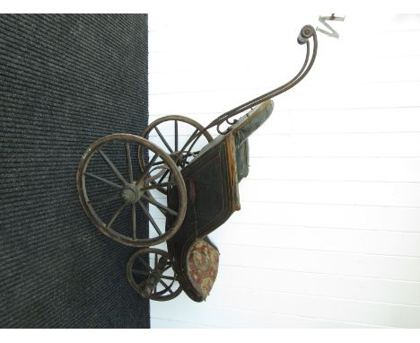 A Victorian iron framed three wheel bath chair with button back seat, for restoration 