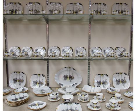 A large quantity of Shelley tablewares Rd No. 783404, pattern 11678 Sunrise and tall trees, including lidded tureen, cake pla