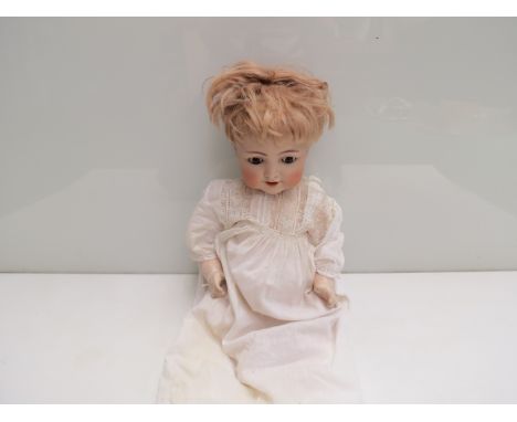 A Simon & Halbig 126 Germany bisque head girl doll for re-stringing 