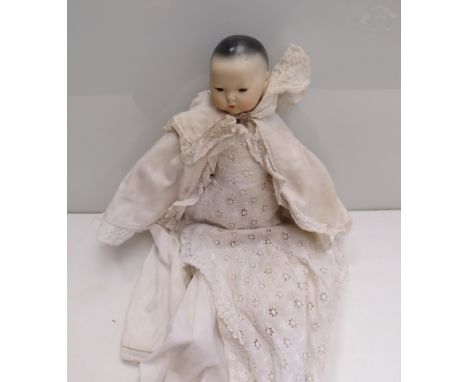 A 12" bisque headed baby doll with sleepy eyes, in long white dress, marked "1" to back of head, hands and feet a/f