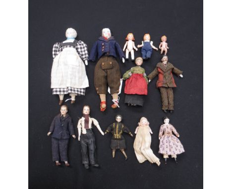 A tray of period dress bisque dolls house dolls