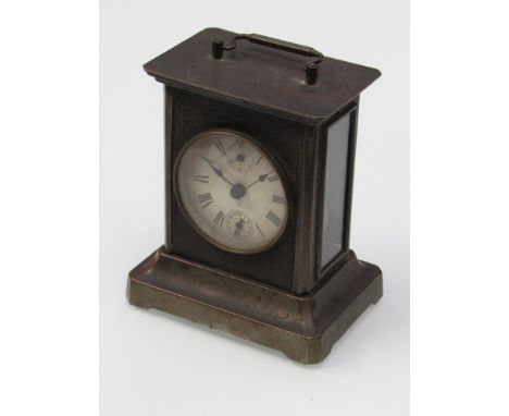 An early 20th Century American musical carriage clock in base metal case playing two songs 'The Bluebells of Scotland' and 'A