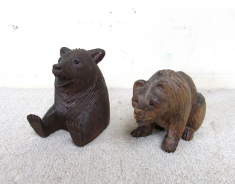 A Black Forest bear as an inkwell with associated glass inkwell and a seated example (2) 