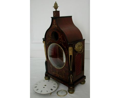 A Regency mahogany bracket clock case with pagoda top, decorative brass inlay, ormulu acorn finial, side handles and sphynx m