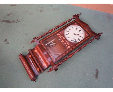 A late 19th/early 20th Century American drop dial wall clock with rosewood veneered/satin and ebony inlaid case, painted meta
