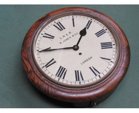 An oak dial clock with Roman dial signed LNER R. Jones & Co, London, fusee movement, with pendulum 