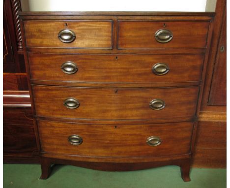 A crossbanded mahogany bow front chest of two short over three graduating long drawers on outswept bracket feet 