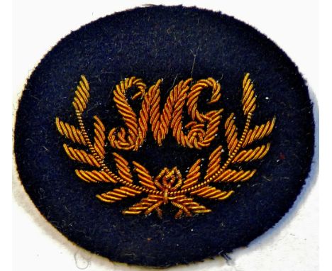 British WWII Army First Class Sub Machine Gunner cloth patch. Nice Condition.