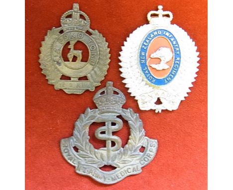 New Zealand Cap Badges (3) all with lugs missing:- 1. Royal New Zealand Army Medical Corps, KC, brass.  (Based on the R.A.M.C