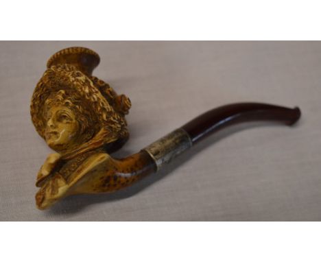 A meerschaum pipe in the form of a ladies head with a silver collar 